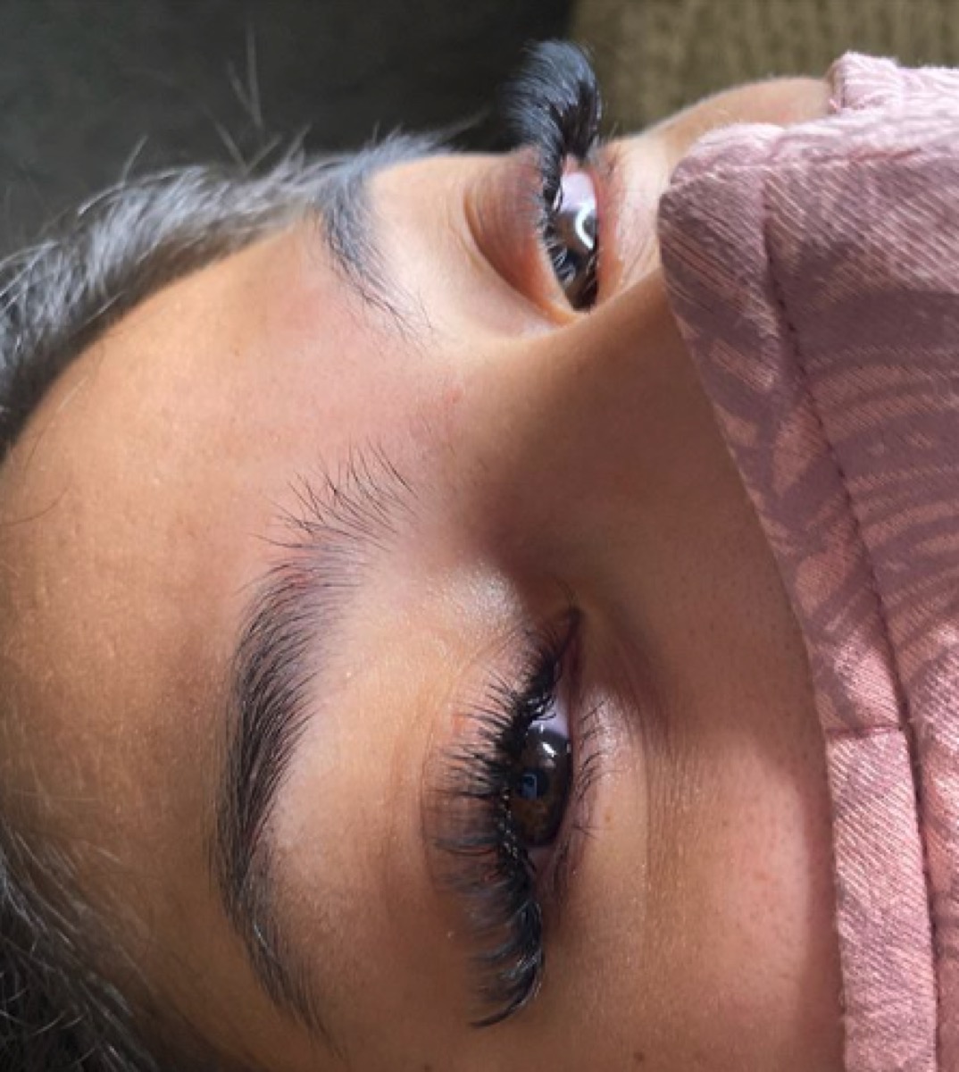 Close-up of classic lash extension application